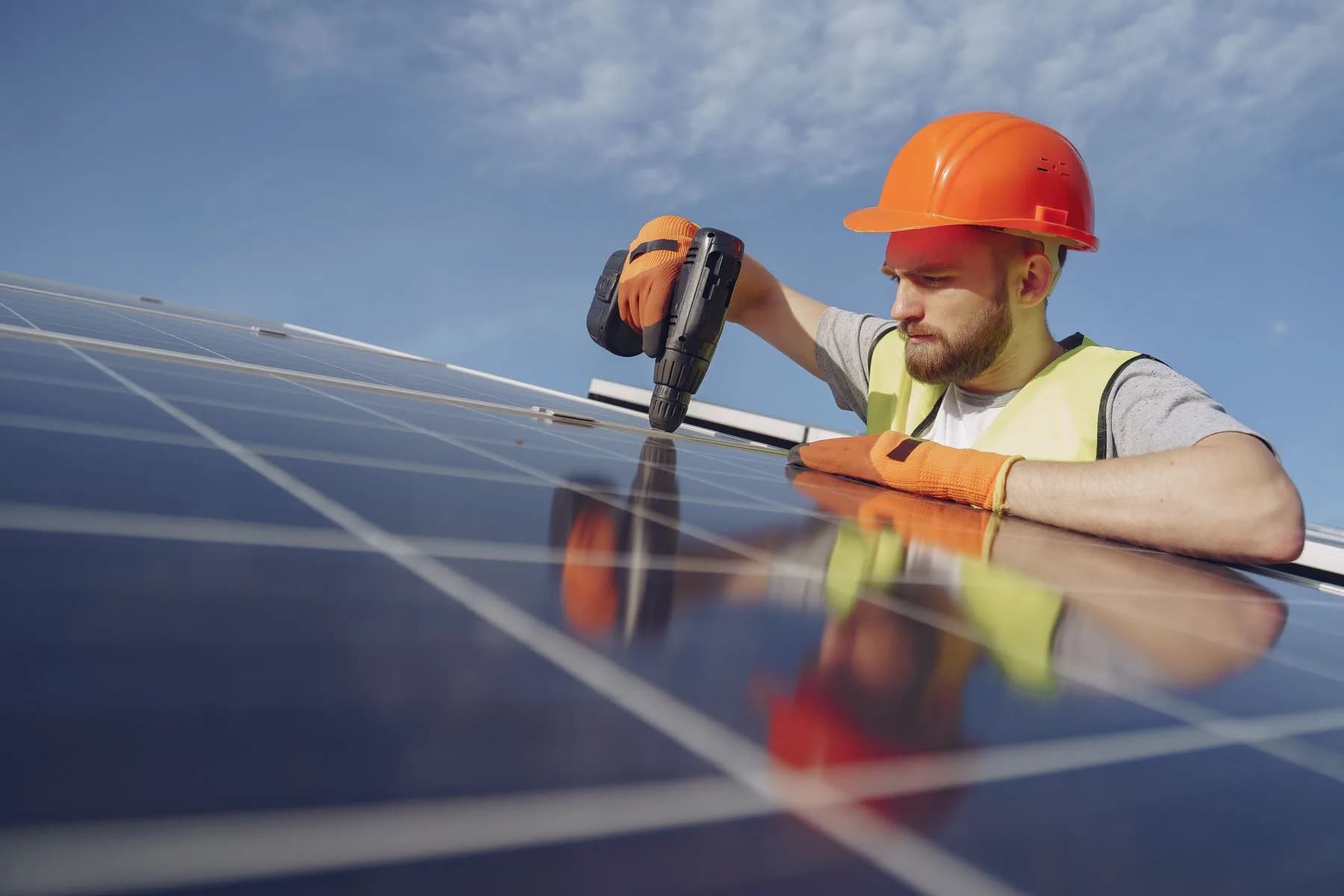 Electrician installing a solar panel